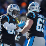 Carolina Panthers running back D'Onta Foreman celebrates after scoring with guard Austin Corbett during the first half of an NFL football game between the Carolina Panthers and the Detroit Lions on Saturday, Dec. 24, 2022, in Charlotte, N.C. (AP Photo/Rusty Jones)