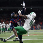 
              North Texas wide receiver Jyaire Shorter (16) makes a touchdown catch over UTSA cornerback Ken Robinson (21) during the second half of an NCAA college football game for the Conference USA championship in San Antonio, Friday, Dec. 2, 2022. (AP Photo/Eric Gay)
            