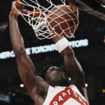 
              Toronto Raptors' O.G. Anunoby dunks during the first half of an NBA basketball game against the Orlando Magic, Saturday, Dec. 3, 2022 in Toronto. (Chris Young/The Canadian Press via AP)
            