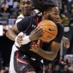 
              Missouri's D'Moi Hodge, left, knocks the ball away from Southeast Missouri State's Kobe Clark, right, during the first half of an NCAA college basketball game Sunday, Dec. 4, 2022, in Columbia, Mo. (AP Photo/L.G. Patterson)
            