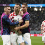 
              Croatia's Ivan Perisic, second left, celebrates with teammates after scoring his side's opening goal during the World Cup round of 16 soccer match between Japan and Croatia at the Al Janoub Stadium in Al Wakrah, Qatar, Monday, Dec. 5, 2022. (AP Photo/Thanassis Stavrakis)
            