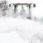 
              Legend Excavating worker Garrett LaCross plows snow off Interstate 33 in Buffalo, N.Y., on Tuesday, Dec. 27, 2022. Clean up is currently under way after a blizzard hit four Western New York counties. (Joseph Cooke/The Buffalo News via AP)
            