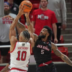 Utah guard Marco Anthony (10) goes to the basket as Jacksonville State guard Skyelar Potter (5) defends during the first half of an NCAA college basketball game Thursday, Dec. 8, 2022, in Salt Lake City. (AP Photo/Rick Bowmer)