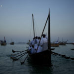 
              Men stand on a boat at Katara Beach in Doha, Qatar, Monday, Dec. 5, 2022. (AP Photo/Natacha Pisarenko)
            