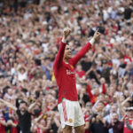 
              FILE -  Manchester United's Cristiano Ronaldo celebrates after scoring his third goal during the English Premier League soccer match between Manchester United and Norwich City at Old Trafford stadium in Manchester, England, Saturday, April 16, 2022. Saudi Arabian soccer club Al Nassr on Friday, Dec. 30, 2022, announced the signing of Ronaldo, ending speculation about the five-time Ballon d'Or winner's future. (AP Photo/Jon Super, File)
            