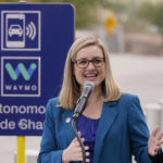 
              Phoenix Mayor Kate Gallego announces a new self-driving vehicle service, Friday, Dec. 16, 2022, at the Sky Harbor International Airport Sky Train facility in Phoenix. Mayor Gallego announced Friday that Sky Harbor will be the first airport to have self-driving, ride-hailing service Waymo available. A test group has been using Waymo vehicles from the airport's sky train to downtown Phoenix since early November.(AP Photo/Matt York)
            