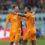 Daley Blind of the Netherlands celebrates after scoring his side's second goal with Memphis Depay of the Netherlands during the World Cup round of 16 soccer match between the Netherlands and the United States, at the Khalifa International Stadium in Doha, Qatar, Saturday, Dec. 3, 2022. (AP Photo/Natacha Pisarenko)