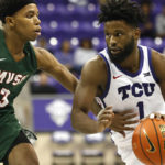 
              TCU guard Mike Miles Jr. (1) handles the ball as Mississippi Valley State guard Kadar Waller (3) defends during the second half of an NCAA college basketball game, Sunday, Dec. 18, 2022, in Fort Worth, Texas. (AP Photo/Ron Jenkins)
            