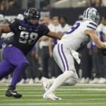 TCU defensive lineman Dylan Horton (98) moves in to sack Kansas State quarterback Will Howard (18) in the first half of the Big 12 Conference championship NCAA college football game, Saturday, Dec. 3, 2022, in Arlington, Texas. (AP Photo/LM Otero)