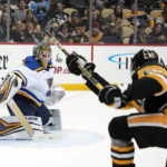 
              St. Louis Blues goaltender Thomas Greiss (1) stops a shot by Pittsburgh Penguins' Rickard Rakell (67) during the second period of an NHL hockey game in Pittsburgh, Saturday, Dec. 3, 2022. (AP Photo/Gene J. Puskar)
            