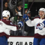 Colorado Avalanche center Evan Rodrigues celebrates his goal against the Arizona Coyotes with Avalanche right wing Mikko Rantanen, right, during the first period of an NHL hockey game in Tempe, Ariz., Tuesday, Dec. 27, 2022. (AP Photo/Ross D. Franklin)