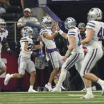 Kansas State wide receiver RJ Garcia II, center, celebrates his touchdown with teammates in the second half of the Big 12 Conference championship NCAA college football game against TCU, Saturday, Dec. 3, 2022, in Arlington, Texas. (AP Photo/LM Otero)