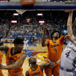 
              Kansas Jayhawks guard Gradey Dick, right, shoots over Oklahoma State guard Woody Newton (4) during the first half of an NCAA college basketball game Saturday, Dec. 31, 2022, in Lawrence, Kan. (AP Photo/Charlie Riedel)
            