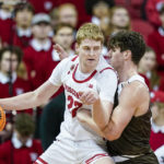 
              Wisconsin's Steven Crowl (22) drives against Lehigh's Dominic Parolin (35) during the first half of an NCAA college basketball game Thursday, Dec. 15, 2022, in Madison, Wis. (AP Photo/Andy Manis)
            