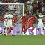 
              South Korea's Kim Young-gwon, second from right, celebrates after scoring his side's first goal during the World Cup group H soccer match between South Korea and Portugal, at the Education City Stadium in Al Rayyan , Qatar, Friday, Dec. 2, 2022. (AP Photo/Hassan Ammar)
            