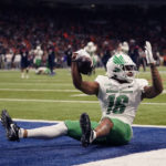 
              North Texas wide receiver Jyaire Shorter (16) celebrates after making a touchdown catch against UTSA during the second half of an NCAA college football game for the Conference USA championship in San Antonio, Friday, Dec. 2, 2022. (AP Photo/Eric Gay)
            