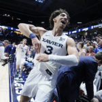 
              Xavier's Colby Jones (3) reacts after defeating Connecticut in an NCAA college basketball game, Saturday, Dec. 31, 2022, in Cincinnati. (AP Photo/Jeff Dean)
            