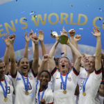 
              FILE - United States' Megan Rapinoe lifts up a trophy after winning the Women's World Cup final soccer match between U.S. and The Netherlands at the Stade de Lyon in Decines, outside Lyon, France, July 7, 2019. The House has passed a bill that ensures equal compensation for U.S. women competing in international events, a piece of legislation that came out of the U.S. women's soccer team's long battle to be paid as much as the men. The Equal Pay for Team USA Act, passed late Wednesday night,  Dec. 21, 2022, now heads to President Joe Biden's desk. (AP Photo/Alessandra Tarantino, File)
            