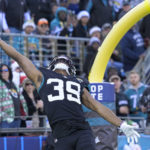 Jacksonville Jaguars wide receiver Jamal Agnew (39) reaches for an incomplete pass during the second half of an NFL football game against the Dallas Cowboys, Sunday, Dec. 18, 2022, in Jacksonville, Fla. (AP Photo/Phelan M. Ebenhack)