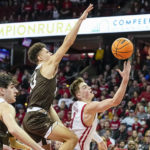 
              Wisconsin's Connor Essegian (3) shoots against Lehigh's Keith Higgins (13) during the second half of an NCAA college basketball game Thursday, Dec. 15, 2022, in Madison, Wis. Wisconsin won 78-56. (AP Photo/Andy Manis)
            