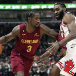 
              Cleveland Cavaliers guard Caris LeVert, left, drives against Chicago Bulls forward Patrick Williams during the first half of an NBA basketball game in Chicago, Saturday, Dec. 31, 2022. (AP Photo/Nam Y. Huh)
            