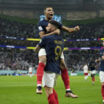 
              France's Olivier Giroud celebrates with France's Kylian Mbappe, after scoring the opening goal during the World Cup round of 16 soccer match between France and Poland, at the Al Thumama Stadium in Doha, Qatar, Sunday, Dec. 4, 2022. (AP Photo/Ebrahim Noroozi)
            