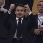 French president Emmanuel Macron gestures during the World Cup semifinal soccer match between France and Morocco at the Al Bayt Stadium in Al Khor, Qatar, Wednesday, Dec. 14, 2022. (AP Photo/Manu Fernandez)