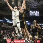
              Wake Forest guard Cameron Hildreth (2) goes in for a layup with pressure from Appalachian State forward Christopher Mantis (2) in the first half of an NCAA college basketball game on Wednesday, Dec. 14, 2022, at Joel Coliseum in Winston-Salem, N.C. (Allison Lee Isley/The Winston-Salem Journal via AP)
            