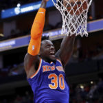 
              New York Knicks forward Julius Randle (30) dunks against the Houston Rockets during the first half of an NBA basketball game Saturday, Dec. 31, 2022, in Houston. (AP Photo/Michael Wyke)
            