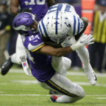 Indianapolis Colts wide receiver Ashton Dulin (16) is tackled by Minnesota Vikings safety Camryn Bynum (24) after catching a pass during the first half of an NFL football game, Saturday, Dec. 17, 2022, in Minneapolis. (AP Photo/Andy Clayton-King)