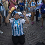 
              An Argentine soccer fan cheers during a rally in support of the national soccer team, a day ahead of the World Cup final against France, in Buenos Aires, Argentina, Saturday, Dec. 17, 2022.(AP Photo/Rodrigo Abd)
            