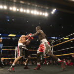 
              Terence Crawford, right, fights David Avanesyan during a World Boxing Organization welterweight world title boxing match on Saturday, Dec. 10, 2022, in Omaha, Neb. Crawford knocked out Avanesyan in the sixth round. (AP Photo/Rebecca S. Gratz)
            