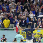 France's Kylian Mbappe celebrates after scoring his side's third goal during the World Cup round of 16 soccer match between France and Poland, at the Al Thumama Stadium in Doha, Qatar, Sunday, Dec. 4, 2022. (AP Photo/Natacha Pisarenko)