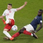 
              Poland's Przemyslaw Frankowski, left, fight for the ball with , France's Dayot Upamecano during the World Cup round of 16 soccer match between France and Poland, at the Al Thumama Stadium in Doha, Qatar, Sunday, Dec. 4, 2022. (AP Photo/Luca Bruno)
            