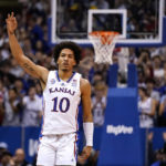 Kansas forward Jalen Wilson celebrates after making a basket during the first half of an NCAA college basketball game against Seton Hall Thursday, Dec. 1, 2022, in Lawrence, Kan. (AP Photo/Charlie Riedel)