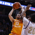 
              Tennessee forward Olivier Nkamhoua (13) goes to shoot as he is defended by Alcorn State forward Darryl Jordan (20) during the second half of an NCAA college basketball game Sunday, Dec. 4, 2022, in Knoxville, Tenn. (AP Photo/Wade Payne)
            