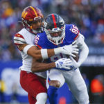 
              New York Giants' Darius Slayton, right, makes a catch during the first half of an NFL football game against the Washington Commanders, Sunday, Dec. 4, 2022, in East Rutherford, N.J. (AP Photo/John Munson)
            