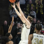 Wake Forest forward Andrew Carr (11) shoots the game-winning shot on the buzzer in the second half of an NCAA college basketball game against Appalachian State on Wednesday, Dec. 14, 2022, at Joel Coliseum in Winston-Salem, N.C. (Allison Lee Isley/The Winston-Salem Journal via AP)