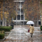 
              Umbrellas come out near the Van Nuys, Calif., courthouse as rain begins to fall Tuesday, Dec. 27, 2022. One-half to two inches of rain is expected in Southern California through Wednesday. (David Crane/The Orange County Register via AP)
            