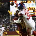 
              New York Giants cornerback Darnay Holmes (30) defends Washington Commanders wide receiver Curtis Samuel (10) on fourth down to seal a 20-12 victory, Sunday, Dec. 18, 2022, in Landover, Md. (AP Photo/Nick Wass)
            