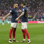
              France's Theo Hernandez, right, celebrates with Kylian Mbappe after scoring the opening goal during the World Cup semifinal soccer match between France and Morocco at the Al Bayt Stadium in Al Khor, Qatar, Wednesday, Dec. 14, 2022. (AP Photo/Christophe Ena)
            