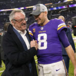 Minnesota Vikings owner Zygi Wilf celebrates with quarterback Kirk Cousins (8) after an NFL football game against the Indianapolis Colts, Saturday, Dec. 17, 2022, in Minneapolis. The Vikings won 39-36 in overtime. (AP Photo/Abbie Parr)
