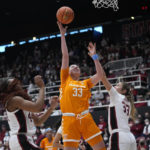 
              Tennessee guard Marta Suarez (33) shoots between Stanford forward Kiki Iriafen, left, and guard Hannah Jump during the first half of an NCAA college basketball game in Stanford, Calif., Sunday, Dec. 18, 2022. (AP Photo/Godofredo A. Vásquez)
            