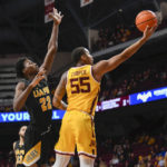 Minnesota guard Ta'Lon Cooper drives past Arkansas-Pine Bluff forward Robert Lewis for a basket during the first half of an NCAA college basketball game on Wednesday, Dec. 14, 2022, in Minneapolis. (AP Photo/Craig Lassig)
