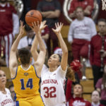 Indiana forward Alyssa Geary (32) attempts to block a shot by Morehead State forward Sophie Benharouga (14) during the second half of an NCAA college basketball game, Sunday, Dec. 18, 2022, in Bloomington, Ind. (AP Photo/Doug McSchooler)