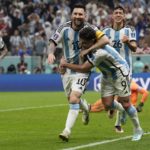 
              Argentina's Lionel Messi, left, and Argentina's Julian Alvarez celebrate after scoring during the World Cup semifinal soccer match between Argentina and Croatia at the Lusail Stadium in Lusail, Qatar, Tuesday, Dec. 13, 2022. (AP Photo/Martin Meissner)
            