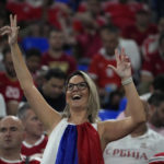 A Serbian supporter gestures during the World Cup group G soccer match between Serbia and Switzerland, at the Stadium 974 in Doha, Qatar, Friday, Dec. 2, 2022. (AP Photo/Ebrahim Noroozi)