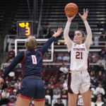Stanford forward Brooke Demetre (21) takes a 3-point shot over Gonzaga guard Esther Little (0) during the second half of an NCAA college basketball game in Stanford, Calif., Sunday, Dec. 4, 2022. (AP Photo/Tony Avelar)