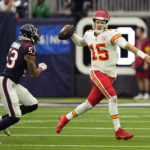 
              Kansas City Chiefs quarterback Patrick Mahomes (15) is pressured by Houston Texans linebacker Blake Cashman (53) as he looks to throw during the first half of an NFL football game Sunday, Dec. 18, 2022, in Houston. (AP Photo/David J. Phillip)
            