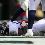 
              Tennessee Titans' Treylon Burks lies on the ground injured after scoring a touchdown during the first half of an NFL football game against the Philadelphia Eagles, Sunday, Dec. 4, 2022, in Philadelphia. (AP Photo/Matt Slocum)
            